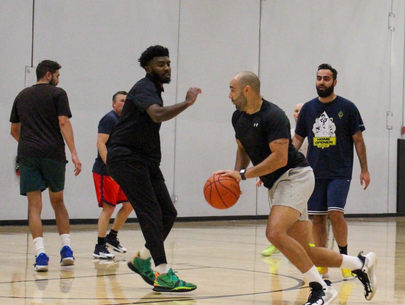 Adults playing pickup basketball